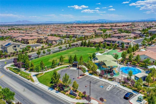 Aerial view of residential area with a mountainous background and a pool area | Image 62
