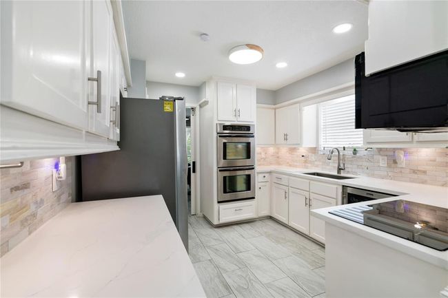 Kitchen, showcasing double ovens | Image 12