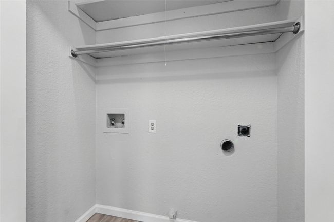 Laundry room featuring electric dryer hookup, hookup for a washing machine | Image 18