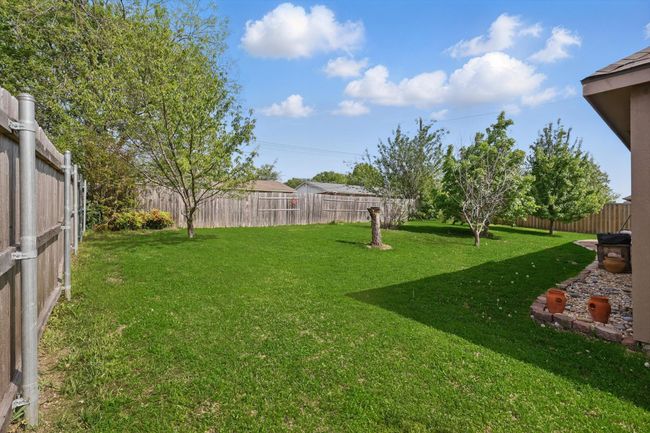 View of yard with a fenced backyard | Image 36