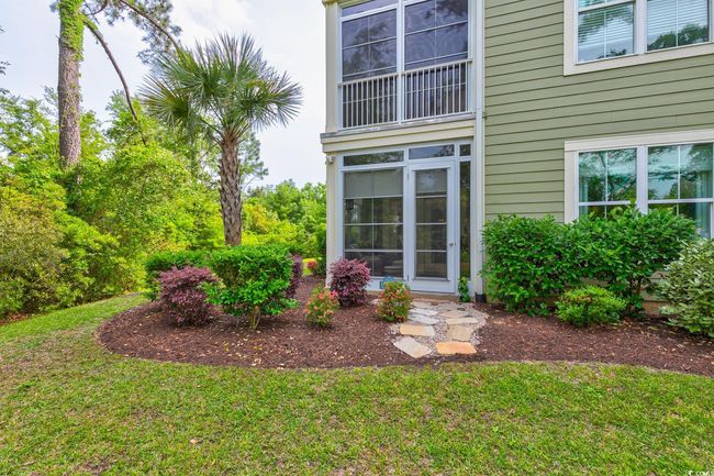 View of side of home featuring board and batten siding and a lawn | Image 34