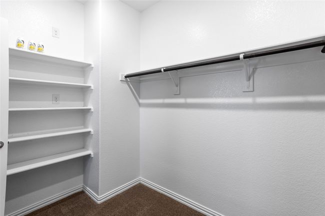 Walk-In Closet with built in shelving in Primary Bedroom | Image 26