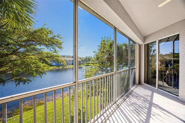 Unfurnished sunroom with a water view | Image 18
