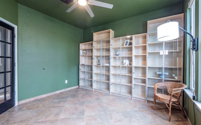 Laundry room with dryer and washing machine hook ups, built in cabinets and space for freezer, extra fridge or more cabinets. | Image 23
