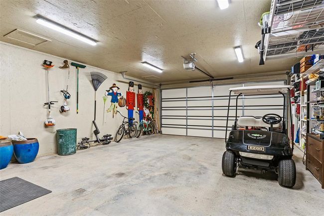 Garage with a garage door opener | Image 35