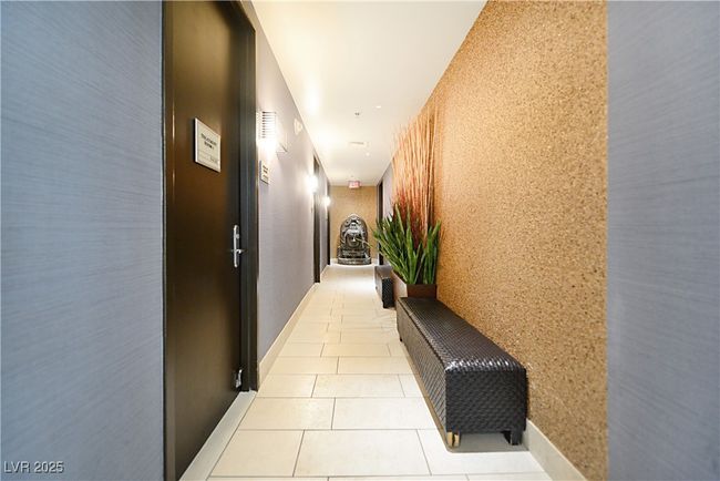 Common area hallway featuring light tile patterned flooring | Image 49