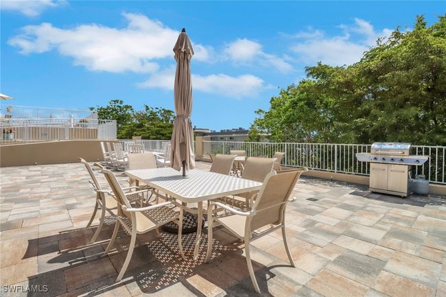 View of patio / terrace with a grill and outdoor dining space | Image 17