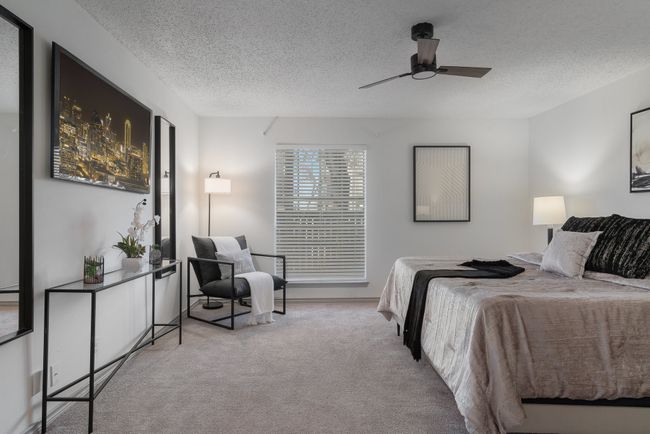 Bedroom with a ceiling fan, carpet flooring, and a textured ceiling | Image 26