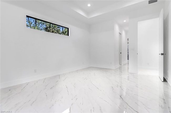 Unfurnished room with light tile patterned floors | Image 23