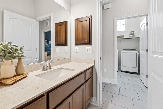 Convenient laundry location downstairs near secondary bedrooms | Image 19