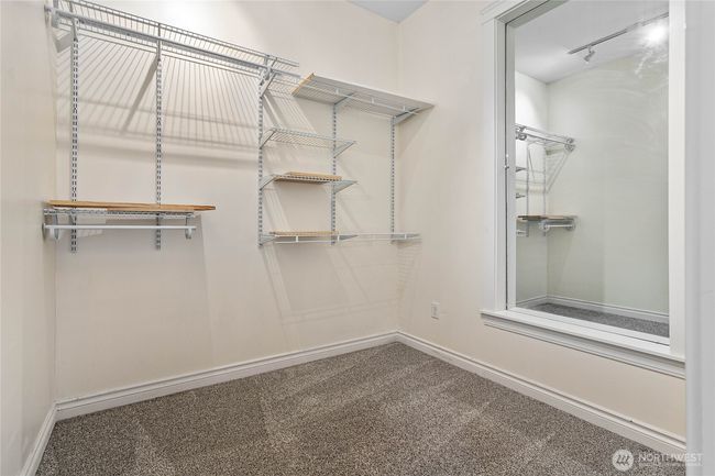 Walk-in closet is more like an additional room. There are water lines stubbed into the wall on the left. You could put a washer/dryer in here. | Image 31