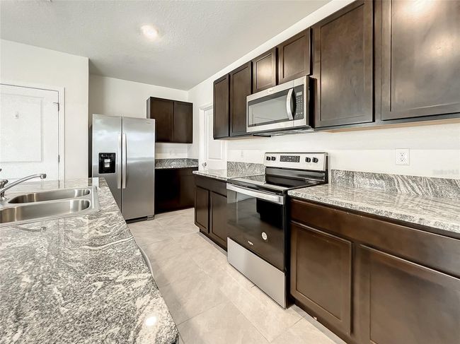 10556 Penny Gale Loop, House other with 5 bedrooms, 4 bathrooms and null parking in SAN ANTONIO FL | Image 15