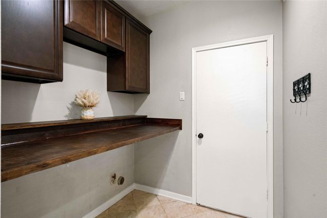 Utility room with 42" cabinets for extra storage. | Image 18