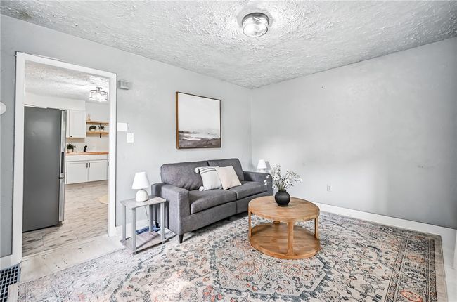 Living room opens to kitchen | Image 9