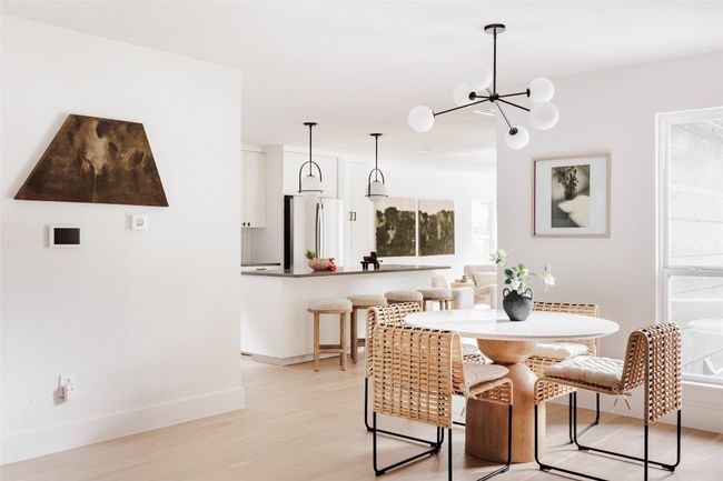 Dining space with light wood-style flooring and a chandelier | Image 5