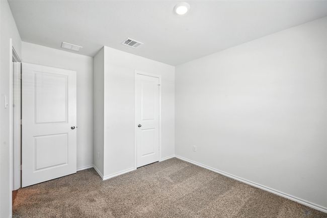 Unfurnished bedroom featuring carpet and baseboards | Image 10