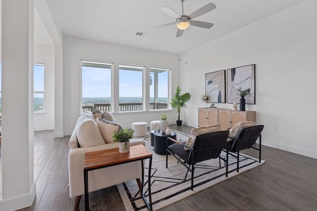 The living room provides abundant space for you to make your interior design dreams come true. | Image 12