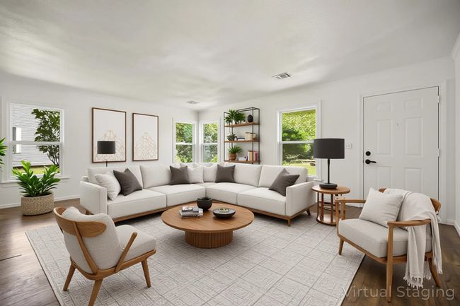 Living room featuring wood finished floors and baseboards | Image 5