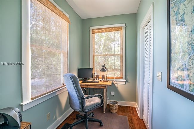 Office space featuring dark hardwood / wood-style floors | Image 26