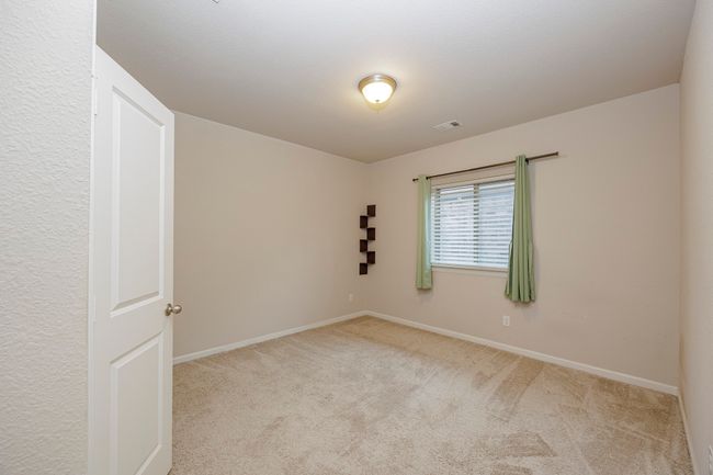 Carpeted empty room with baseboards | Image 29