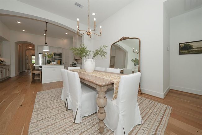 Elegant archway enhances the charm of the formal dining room. | Image 10
