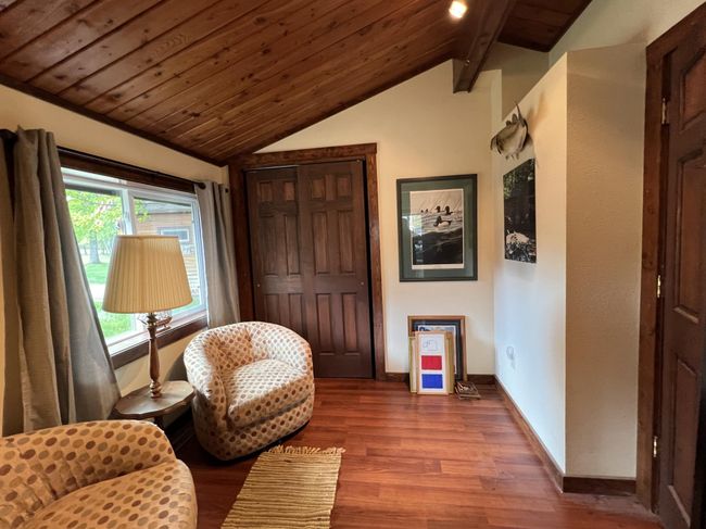 Den, sitting or crafting are a few things you can do with this room | Image 28