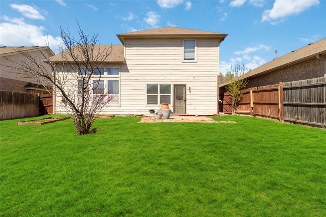 Back of property with a lawn and a fenced backyard | Image 24