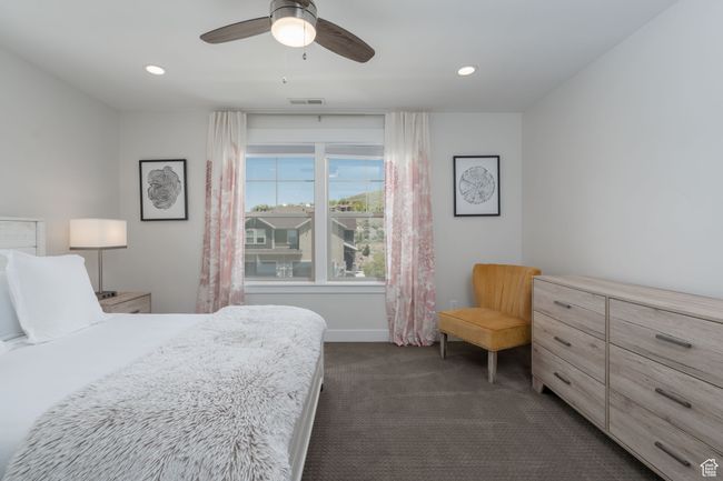 Bedroom with dark carpet, recessed lighting, baseboards, and ceiling fan | Image 28