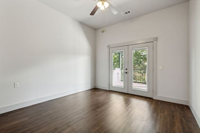 Unfurnished room featuring ceiling fan, french doors, and dark hardwood / wood-style floors | Image 14