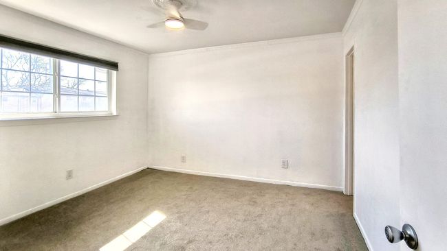 Carpeted spare room with ceiling fan | Image 19