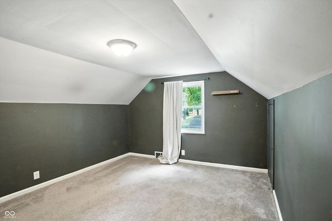 bonus room featuring vaulted ceiling and carpet flooring | Image 33