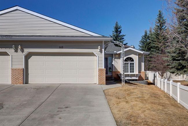 143 Shawnee Manor Sw, Home with 2 bedrooms, 2 bathrooms and 4 parking in Calgary AB | Image 1