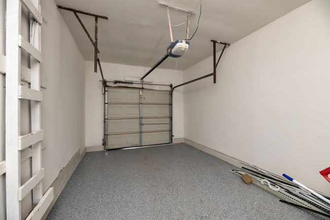 Garage with a garage door opener | Image 24