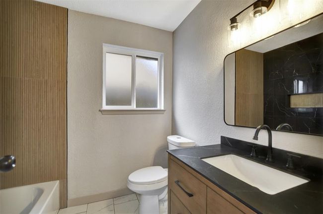 Secondary full bathroom with tub. | Image 32