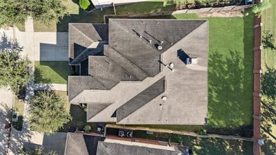 Stunning aerial view showcasing the oversized lot with NO back neighbors, welcoming walkway, double-wide driveway and luscious landscaping. | Image 3