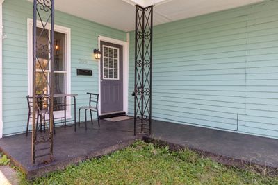 The inviting front porch is a great place to relax | Image 2