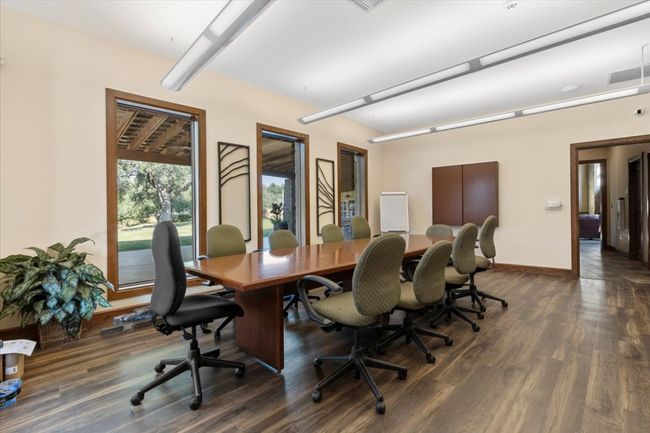 Office space featuring dark wood finished floors and baseboards | Image 28