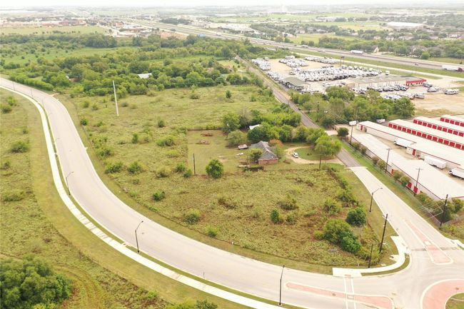 Aerial view of subject and surrounding land at corner of Marketplace & Burleson St | Image 31