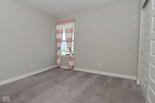 carpeted spare room featuring baseboards | Image 35