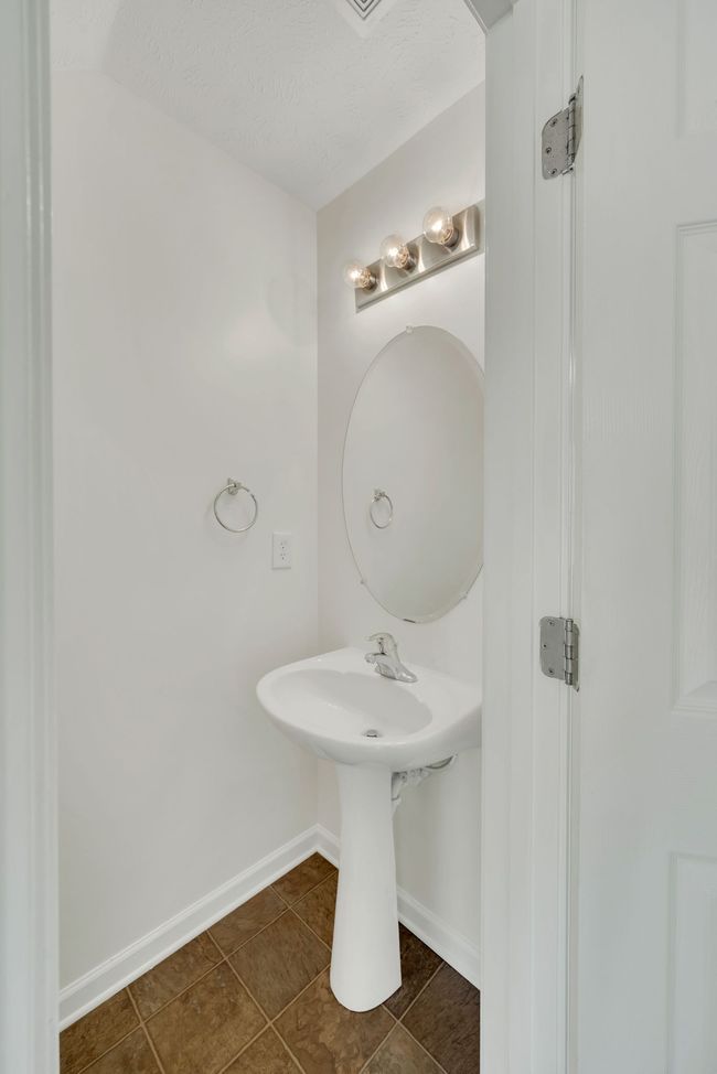 It's always great to have a half bath just off of the den and kitchen! | Image 16