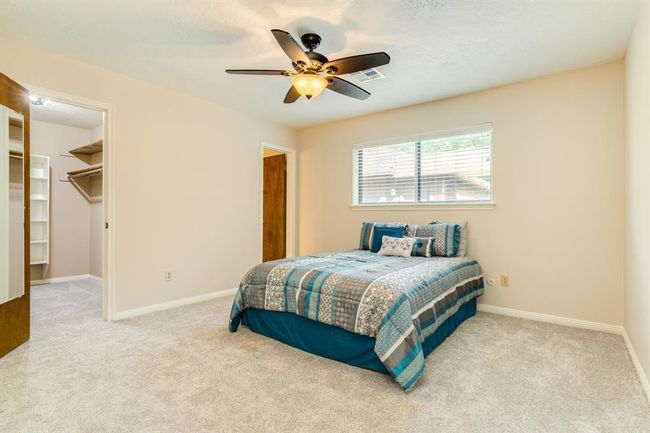 Primary suite offers spacious quarters with a large walk-in closet. New carpet in the bedroom. | Image 21