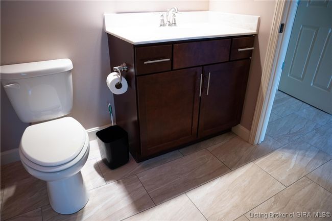 Porcelean tile flooring in full guest bathroom | Image 6
