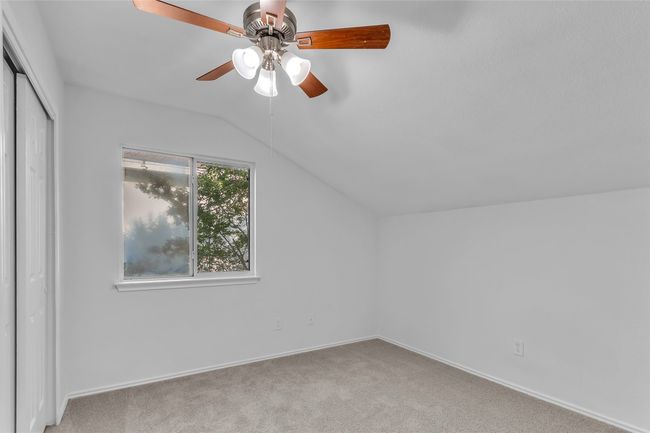 Additional living space with vaulted ceiling, ceiling fan, and carpet | Image 24