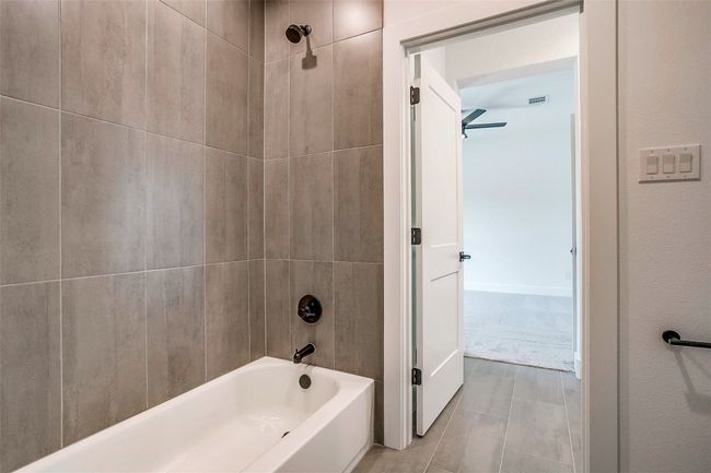 Full bathroom featuring bathing tub / shower combination | Image 32