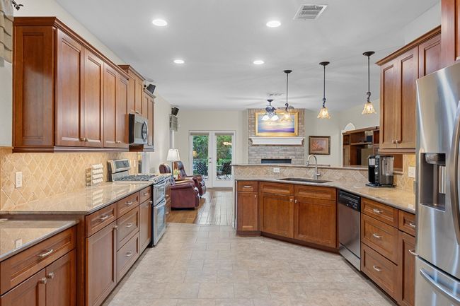 The kitchen is the home's central hub. | Image 14