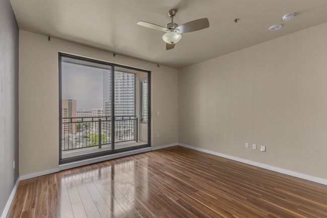Unfurnished room featuring baseboards, a ceiling fan, and wood finished floors | Image 10