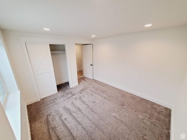 Unfurnished bedroom with recessed lighting, carpet flooring, and baseboards | Image 27