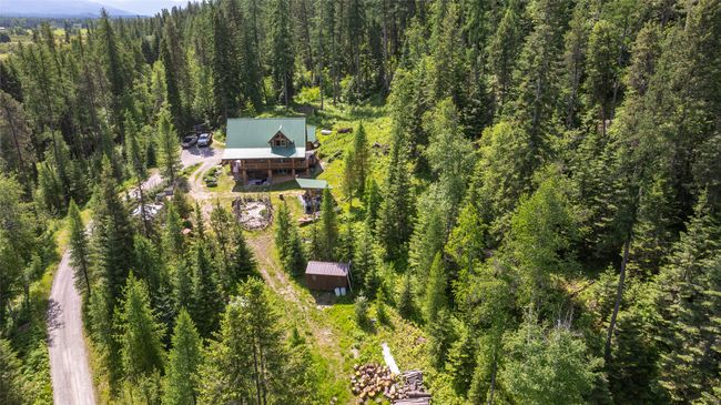 View of property location featuring a forest | Image 48