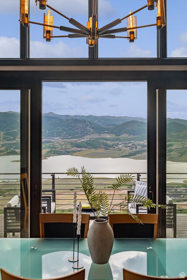 Dining area with a chandelier and a mountain view | Image 29