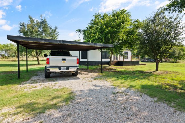 View of car parking with driveway and a carport | Image 8